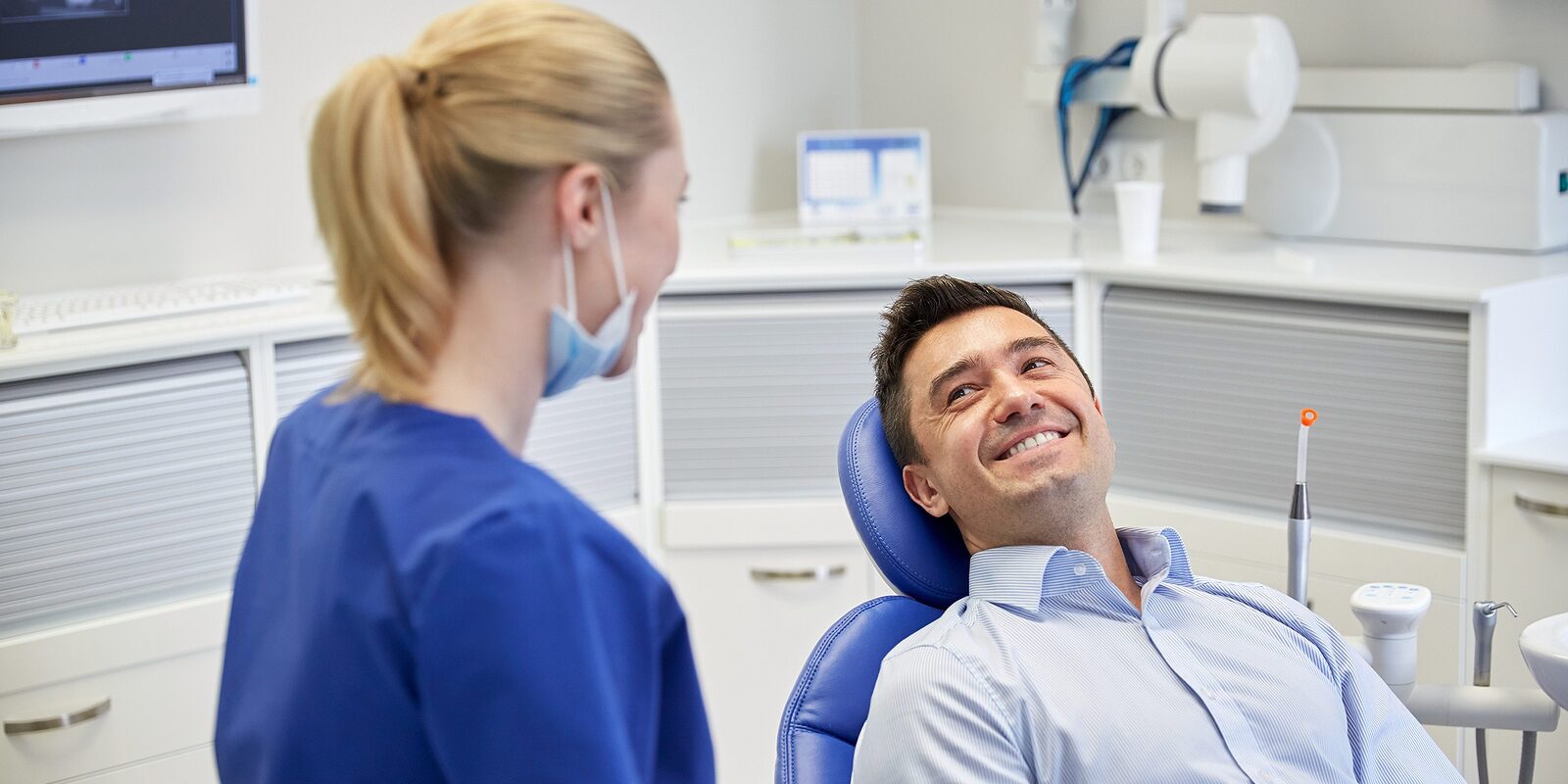 people, medicine, stomatology and health care concept – happy fe choosing the best endodontist